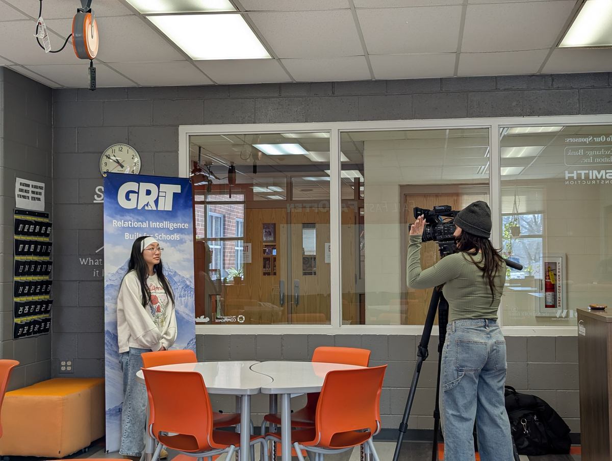 Filming a GRiT segment beside the GRiT banner